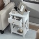 White bedside nightstand with a decorative pull handle, featuring a slide-out drawer and an open bottom shelf for.